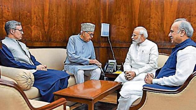 Former J&K CMs Farooq Abdullah, Omar Abdullah and MP Hasnain Masoodi with PM Modi in New Delhi on Thursday.(ANI Photo) Former J&K CMs Farooq Abdullah, Omar Abdullah and MP Hasnain Masoodi with PM Modi in New Delhi on Thursday.(ANI Photo)