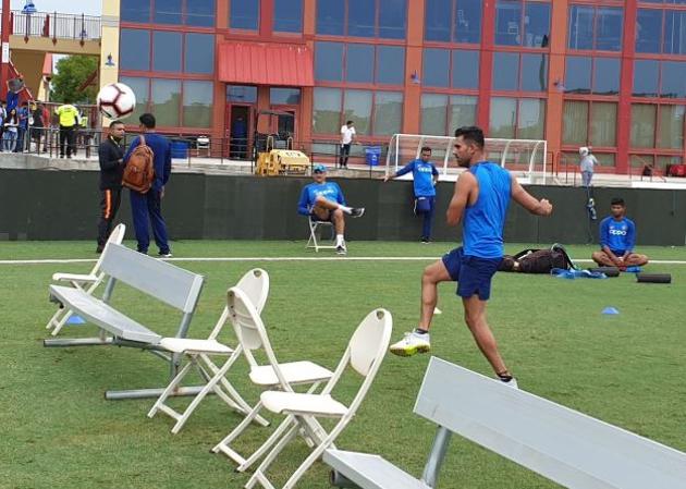 Medium pacer Rahul Chahar kicks a ball as head coach Ravi Shastri looks on during a training session in Florida. (BCCI/ Twitter) 