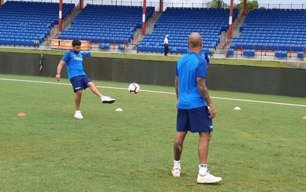 Vice-captain Rohit Sharma kicks a ball as his opening partner Shikhar Dhawan looks on during a training session in Florida. (BCCI/ Twitter) 