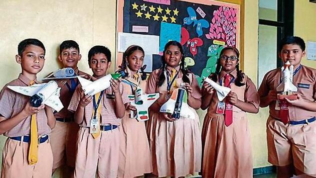 Students show their space shuttle models. Students show their space shuttle models.