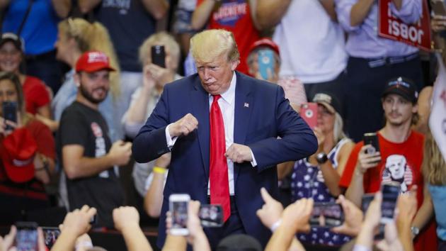 US President Donald Trump gestures to the crowd before exiting a campaign rally at the US Bank Arena, in Cincinnati, Ohio. (John Minchillo / AP) US President Donald Trump gestures to the crowd before exiting a campaign rally at the US Bank Arena, in Cincinnati, Ohio. (John Minchillo / AP)