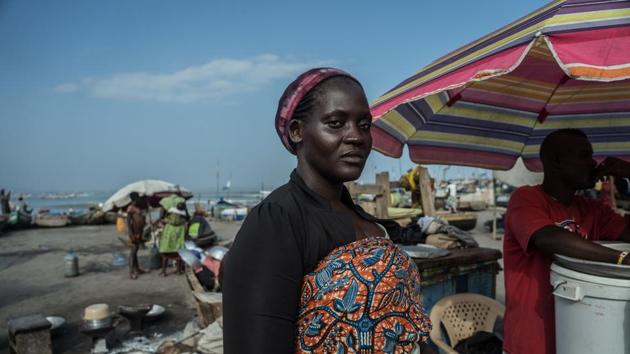 Fish vendor Mercy Allotey waits at the beachfront in Accra for customers to buy the freshest catch brought in by the brightly-coloured dugout canoes plying the coast. But she complains the local fishermen are now netting far less as a combination of illegal techniques and unscrupulous trawlers devastate stocks. “It is spoiling our fishing, Many times when they go they don’t get the fish,” she said. (Natalija Gormalova / AFP)