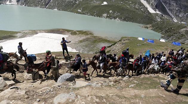 The Jammu and Kashmir government on Friday asked Amarnath Yatris and tourists in Kashmir to “immediately” curtail their stay and leave the valley.(ANI Photo)