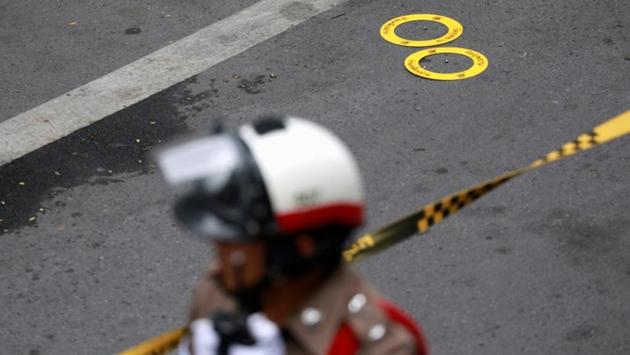 A police officer works near an explosion site in Bangkok, Thailand. Several small bombs exploded across Bangkok on Friday, rattling the Thai capital as it hosted a South-East Asian security meeting with top diplomats from the US, China and other world powers, leaving four people wounded but not disrupting the diplomatic event. (Soe Zeya Tun / REUTERS) A police officer works near an explosion site in Bangkok, Thailand. Several small bombs exploded across Bangkok on Friday, rattling the Thai capital as it hosted a South-East Asian security meeting with top diplomats from the US, China and other world powers, leaving four people wounded but not disrupting the diplomatic event. (Soe Zeya Tun / REUTERS)