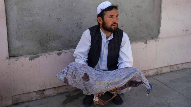 An Afghan man holds the dead body of a child killed when a bus hit a roadside bomb on the Kandahar-Herat highway, at a hospital in Herat, Afghanistan. Dozens of passengers, mainly women and children, were killed in the incident officials said. (Hoshang Hashimi / AFP) An Afghan man holds the dead body of a child killed when a bus hit a roadside bomb on the Kandahar-Herat highway, at a hospital in Herat, Afghanistan. Dozens of passengers, mainly women and children, were killed in the incident officials said. (Hoshang Hashimi / AFP)