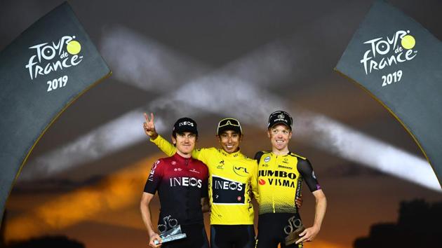 Colombia’s Egan Bernal (C) celebrates his overall leader’s yellow jersey as he poses with second-placed Great Britain’s Geraint Thomas (L) and third-placed Netherlands’ Steven Kruijswijk on the podium of the 21st and last stage of the 106th edition of the Tour de France cycling race between Rambouillet and Champs-Elysees in Paris, France. (Marco Bertorello / AFP) Colombia’s Egan Bernal (C) celebrates his overall leader’s yellow jersey as he poses with second-placed Great Britain’s Geraint Thomas (L) and third-placed Netherlands’ Steven Kruijswijk on the podium of the 21st and last stage of the 106th edition of the Tour de France cycling race between Rambouillet and Champs-Elysees in Paris, France. (Marco Bertorello / AFP)