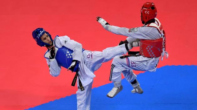 Brazil’s Edival Marques (L) and Dominican Republic’s Bernardo Pie compete in the Taekwondo Men’s Under-68kg final during the Pan-American Games Lima 2019, in Lima, Peru. Marques won the gold medal. (Luis Acosta / AFP) Brazil’s Edival Marques (L) and Dominican Republic’s Bernardo Pie compete in the Taekwondo Men’s Under-68kg final during the Pan-American Games Lima 2019, in Lima, Peru. Marques won the gold medal. (Luis Acosta / AFP)