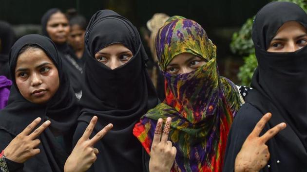 Muslim women celebrate the passage of Triple Talaq Bill in the Rajya Sabha.(PTI) Muslim women celebrate the passage of Triple Talaq Bill in the Rajya Sabha.(PTI)