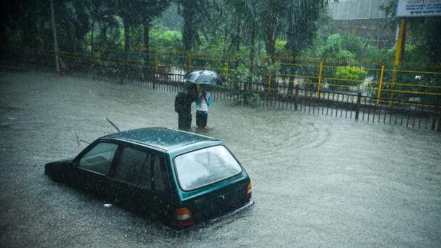 People travelling in cars and on foot alike faced challenges in reaching their destination as water stagnated in many parts of Mumbai due to heavy rains. People travelling in cars and on foot alike faced challenges in reaching their destination as water stagnated in many parts of Mumbai due to heavy rains.