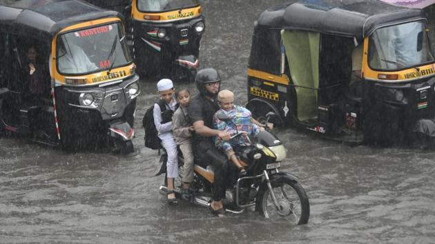 As rain continues to lash Mumbai for the second day today, people have been told by Brihanmumbai Municipal Corporation (BMC) and police to travel only if necessary. Traffic in the city was slow moving throughout the day even as most schools were shut and exams scheduled for the day were cancelled. (Shashi S Kashyap/Hindustan times) As rain continues to lash Mumbai for the second day today, people have been told by Brihanmumbai Municipal Corporation (BMC) and police to travel only if necessary. Traffic in the city was slow moving throughout the day even as most schools were shut and exams scheduled for the day were cancelled. (Shashi S Kashyap/Hindustan times)
