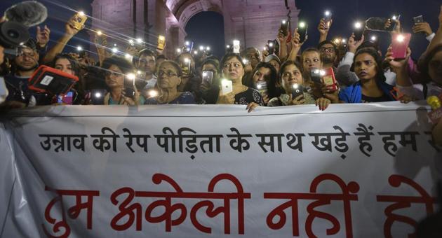 New Delhi, India - July 29, 2019: People use their mobile phones as torches while gathered for a silent protest in solidarity with the Unnao rape case victim, at India Gate in New Delhi, India, on Monday, July 29, 2019. (Photo by Burhaan Kinu/ Hindustan Times)(Burhaan Kinu/HT PHOTO)