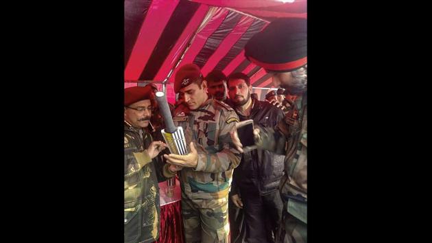 Indian cricketer MS Dhoni, an honorary lieutenant colonel in the Territorial Army signs an autograph, in Srinagar, Jammu and Kashmir. Dhoni commenced his two week stint with the Army on July 31st. (PTI) Indian cricketer MS Dhoni, an honorary lieutenant colonel in the Territorial Army signs an autograph, in Srinagar, Jammu and Kashmir. Dhoni commenced his two week stint with the Army on July 31st. (PTI)