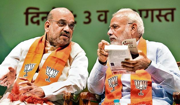 Prime Minister Narendra Modi in conversation with Union Home Minister Amit Shah during the Abhyas Varga (Sansad Karyashala) for all BJP Members of Parliament at Parliament Library Building in New Delhi on Saturday, August 03, 2019.((Photo by Sonu Mehta/ Hindustan Times)) Prime Minister Narendra Modi in conversation with Union Home Minister Amit Shah during the Abhyas Varga (Sansad Karyashala) for all BJP Members of Parliament at Parliament Library Building in New Delhi on Saturday, August 03, 2019.((Photo by Sonu Mehta/ Hindustan Times))