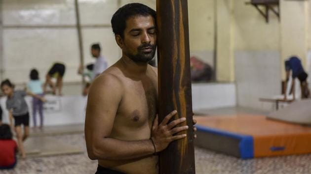 An artist prays before pole Mallakhamb rehearsal at Sane Guruji Arogya Mandir, Santacruz, in Mumbai. Multi-disciplinary performances featuring the indigenous Indian practice was showcased for the first time ever at the Royal Opera House in Mumbai. (Kunal Patil / HT Photo) An artist prays before pole Mallakhamb rehearsal at Sane Guruji Arogya Mandir, Santacruz, in Mumbai. Multi-disciplinary performances featuring the indigenous Indian practice was showcased for the first time ever at the Royal Opera House in Mumbai. (Kunal Patil / HT Photo)