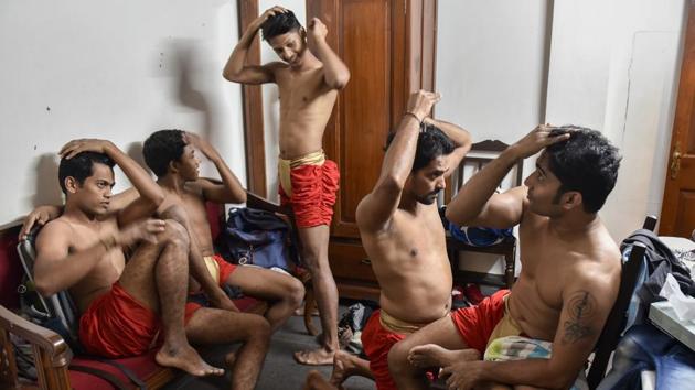 Artist rest before their performances, at the Royal Opera House in Mumbai. As with many other indigenous sports in India, Mallakhamb can trace its roots to ancient times. (Kunal Patil / HT Photo) Artist rest before their performances, at the Royal Opera House in Mumbai. As with many other indigenous sports in India, Mallakhamb can trace its roots to ancient times. (Kunal Patil / HT Photo)