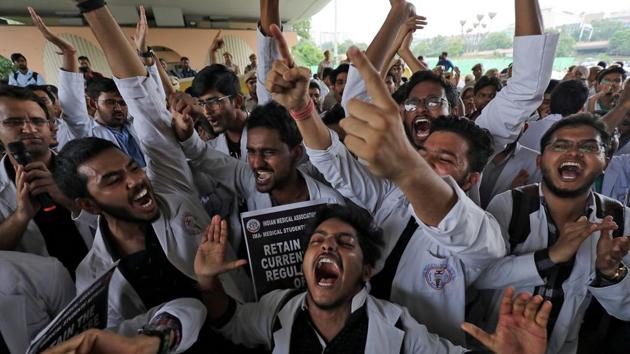 Medical students shout slogans during a protest against National Medical Commission (NMC) Bill, which they say will result in deterioration of medical studies and services, New Delhi, August 1, 2019.(REUTERS)