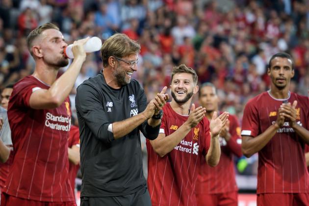 Liverpool's German head coach Jurgen Klopp (2nd L) and his team-players applaud and celebrate at the end of the International friendly football match between Liverpool and Lyon on July 31, 2019 in Geneva.(AFP)