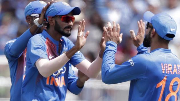 India's Khaleel Ahmed, left, celebrates with with Virat Kohli after taking the wicket of West Indies' Sunil Narine. (AP)