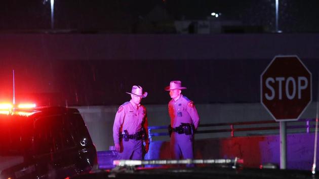 Police keep watch outside Walmart near the scene of a mass shooting which left at least 20 people dead on August 3, 2019 in El Paso, Texas. A 21-year-old male suspect was taken into custody. At least 26 people were wounded.(AFP) Police keep watch outside Walmart near the scene of a mass shooting which left at least 20 people dead on August 3, 2019 in El Paso, Texas. A 21-year-old male suspect was taken into custody. At least 26 people were wounded.(AFP)