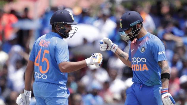 India's Rohit Sharma, left, bumps fist with Virat Kohli, right, during the first Twenty20 international cricket match against the West Indies, Saturday, Aug. 3, 2019, in Lauderhill, Fla. India won by four wickets.(AP)