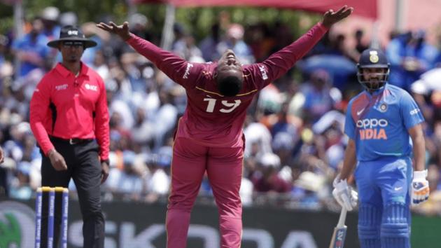 West Indies' Sheldon Cottrell celebrates after taking the wicket of India's Shikhar Dhawan. (AP)