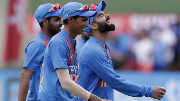 India's Virat Kohli smiles as he walks off the field. (AP)