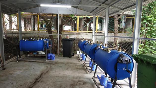 The bio-composter machines installed at Green Garden Apartments in Shivneri Nagar, Govandi (East) are used to convert 50kg of organic waste into nutrient-rich manure.(HT Photo)