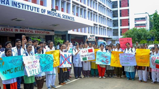 Doctors and medical students raise slogans during a protest against the National Medical Commission (NMC) Bills, Rajendra Institute of Medical Sciences (RIMS) in Ranchi on, August 5, 2019.(PTI)