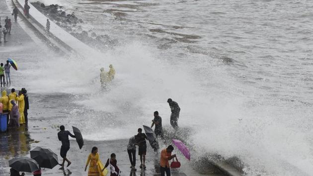 Mumbai, India - Aug. 4, 2019: People enjoy the High Tide at Marine Drives in Mumbai, India, on Sunday, August 4, 2019. (Photo by Anshuman Poyrekar/Hindustan Times)(Anshuman Poyrekar/HT Photo) Mumbai, India - Aug. 4, 2019: People enjoy the High Tide at Marine Drives in Mumbai, India, on Sunday, August 4, 2019. (Photo by Anshuman Poyrekar/Hindustan Times)(Anshuman Poyrekar/HT Photo)