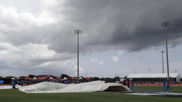 Players walk off the field as weather stops play. (AP) 