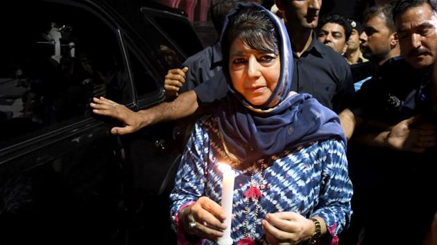 Former Chief Minister of Jammu and Kashmir and PDP leader Mehbooba Mufti during a candle march protest in Srinagar on August 04. National Conference chief Omar Abdullah, PDP chief Mehbooba Mufti and People’s Conference leader Sajad Lone were put under house arrest later in the evening after authorities imposed restriction on the movement across Srinagar. Mobile and internet services have been suspended. (ANI)