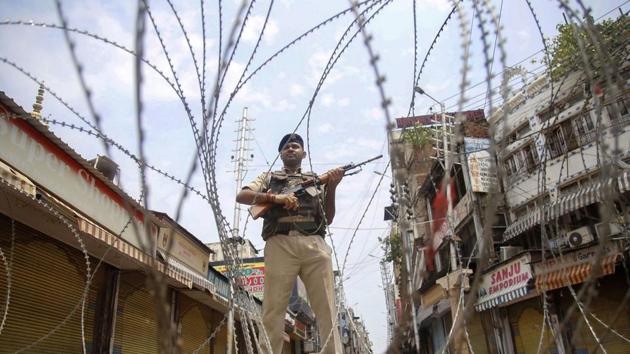 A security person stand guard before the Centre announced scrapping of Article 370. India has consistently maintained that J&K is an integral part of India, that third parties, including the UN, have no role in the state(PTI)