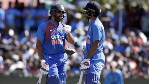 India's Rohit Sharma, left, and Shikhar Dhawan, right, talk. (AP) 