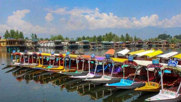 Empty shikaras parked at Dal Lake after government issued security advisory for Amarnath Yatris and tourists to curtail their stay in Kashmir. (PTI)