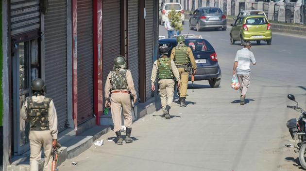 CRPF personnel patrol a street as situation in Kashmir continues to be tense and uncertain, in Srinagar.(PTI Photo)