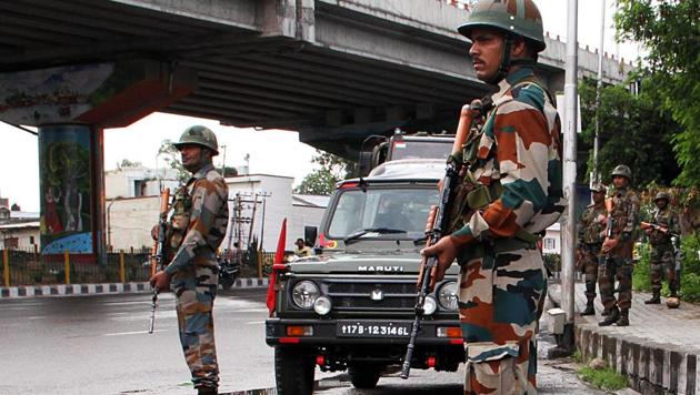 Jammu and Kashmir, August 5 (ANI): Security personnel patrolling the street in Jammu after Centre moved a resolution in the Rajya Sabha to repeal Article 370 of the Constitution to Jammu and Kashmir on Monday.(ANI Photo)