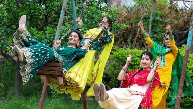 Ladies apply henna designs, spend time singing traditional songs and performing rituals during Hariyali Teej.(PTI)