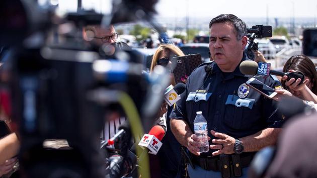 El Paso Police Department Sgt. Robert Gomez briefs media on the shooting. Police said the attacker was charged with capital murder, meaning he could face the death penalty. (Joel Angel Juarez / AFP)