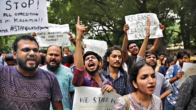 Left party supporters and students protest against the Centre’s move revoking Kashmir's special constitutional status in New Delhi on Monday. (AP Photo) Left party supporters and students protest against the Centre’s move revoking Kashmir's special constitutional status in New Delhi on Monday. (AP Photo)