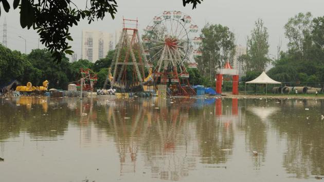 Water logging seen after heavy rain at Sector29 Ground near Leisure Valley Park, in Gurugram.  (Parveen Kumar / HT Photo) 