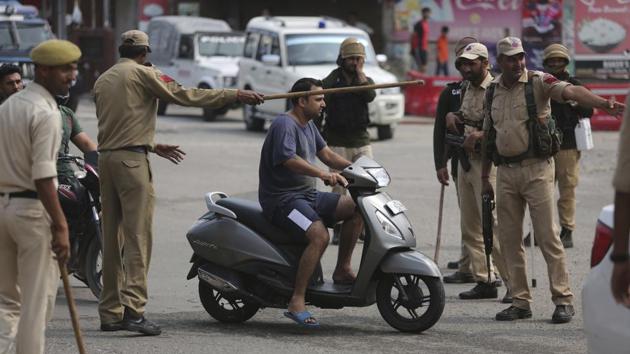 Police check the identity of commuters in Jammu. The NDA government of Prime Minister Narendra Modi moved the “Jammu and Kashmir Reorganisation Bill” for a vote by the Lok Sahba a day after the measure was introduced alongside a presidential order dissolving a constitutional provision that gave Kashmiris exclusive, hereditary rights. (Channi Anand / AP) Police check the identity of commuters in Jammu. The NDA government of Prime Minister Narendra Modi moved the “Jammu and Kashmir Reorganisation Bill” for a vote by the Lok Sahba a day after the measure was introduced alongside a presidential order dissolving a constitutional provision that gave Kashmiris exclusive, hereditary rights. (Channi Anand / AP)