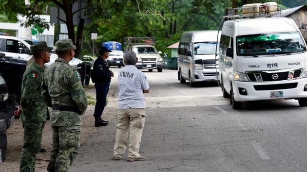A Mexican migrations officer waits at a checkpoint in Palenque. One of the Hondurans given refuge at the Casa del Caminante, says he had to pay members of the Guatemalan security forces three times.”Otherwise they would have made me get off the bus,” travelling with his wife and three children, including a three-month old. (Alfredo Estrella / AFP) A Mexican migrations officer waits at a checkpoint in Palenque. One of the Hondurans given refuge at the Casa del Caminante, says he had to pay members of the Guatemalan security forces three times.”Otherwise they would have made me get off the bus,” travelling with his wife and three children, including a three-month old. (Alfredo Estrella / AFP)