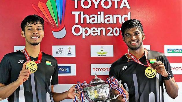 Satwiksairaj Rankireddy and Chirag Shetty pose with their medals and trophy after winning the Thailand Open 2019.(PTI)