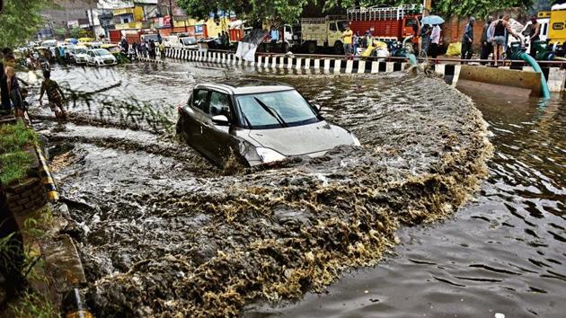 A car wades through a waterlogged Rohtak Road in New Delhi on Tuesday, Aug 6, 2019.(HT Photo) A car wades through a waterlogged Rohtak Road in New Delhi on Tuesday, Aug 6, 2019.(HT Photo)