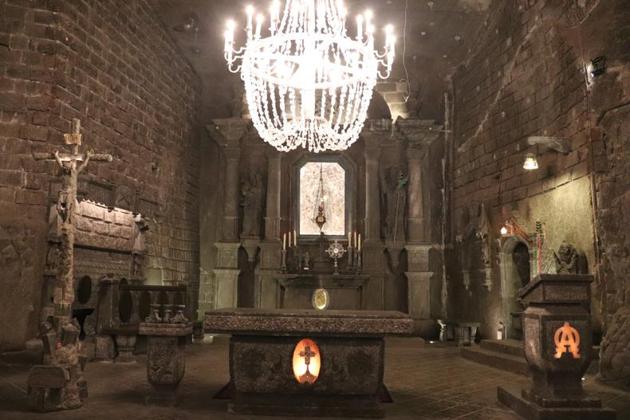 A large salt chandelier in the Chapel of St Kinga. All through the mine are chandeliers like this one — made up of one ring of candles, whose light is then reflected off the thousands of salt crystals in the other tiers.(Karishma Kirpalani)