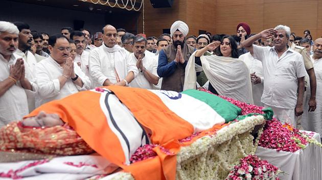 New Delhi, Aug 07 (ANI): Bansuri Swaraj and Swaraj Kaushal, daughter and husband of former External Affairs Minister Sushma Swaraj, pay salute as state honours are accorded to her, at BJP headquarters in New Delhi on Wednesday. (ANI Photo/ R. RAVEENDRAN)