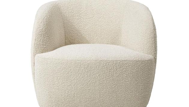 CB2's Gwyneth side chair. Designer John McClain, whose studio is in Orlando, says one big trend he's seeing in fall décor is a range of deep, cozy textures like boucle and shearling.(AP)
