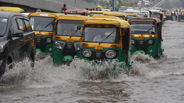 Vehicles wade through a waterlogged road after rains, at IFFCO Chowk, in Gurugram,  on Tuesday, 6 August 2019.