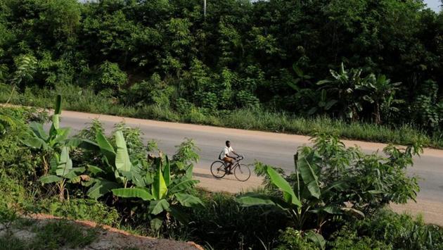 A boy rides a bicycle along a road in Denyase, Ashanti Region. For some of them, the terrible journey began here, deep inside Ghana. Captured by slavers, they were marched along dirt tracks for 200 kilometers (125 miles) to slave castles perched on the Atlantic Coast, where they boarded ships for North America. They never saw their homeland again. (Francis Kokoroko / REUTERS) A boy rides a bicycle along a road in Denyase, Ashanti Region. For some of them, the terrible journey began here, deep inside Ghana. Captured by slavers, they were marched along dirt tracks for 200 kilometers (125 miles) to slave castles perched on the Atlantic Coast, where they boarded ships for North America. They never saw their homeland again. (Francis Kokoroko / REUTERS)