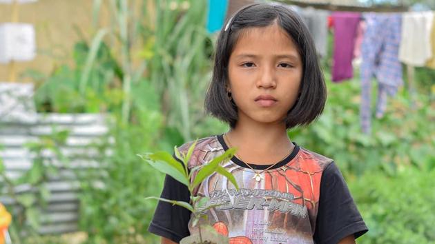 Valentina Elangbam, the little resident of Hiyanglam Makha Leikai in Kakching district had planted the trees near her house about four years ago. (Ramesh Elangbam) Valentina Elangbam, the little resident of Hiyanglam Makha Leikai in Kakching district had planted the trees near her house about four years ago. (Ramesh Elangbam)